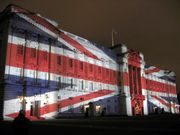 Buckingham Palace with the Union Flag projected onto it